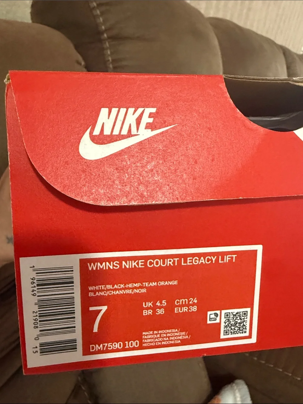 Nike Women's White Sneakers with Black Swoosh and Tan Stripe